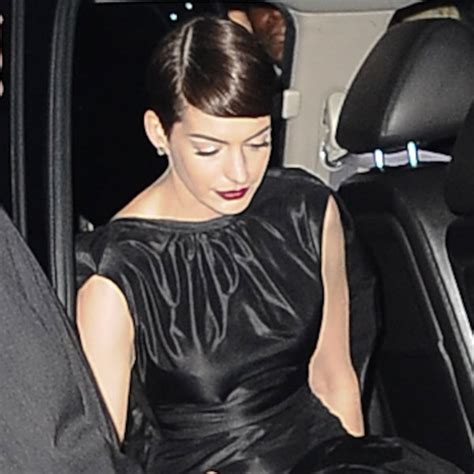 Anne Hathaway Pulls a Britney and Flashes Photographers at Les Mis Premiere