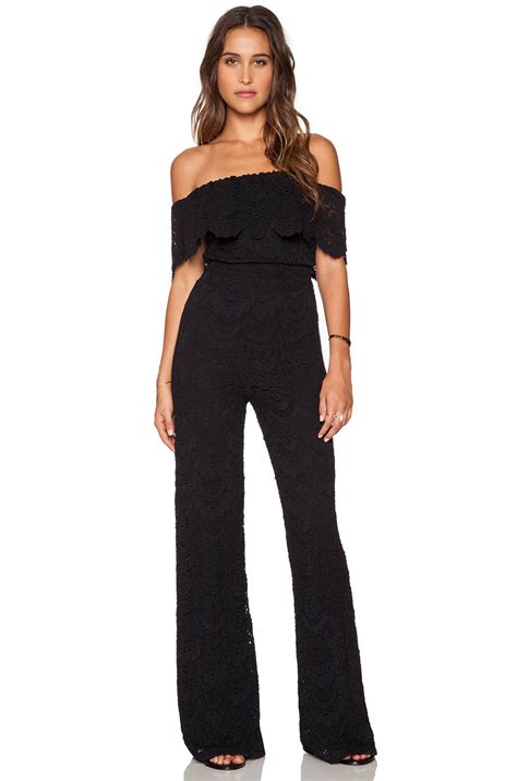 Nightcap Spanish Off Shoulder Jumpsuit in Black | REVOLVE