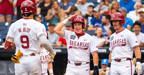 2025 College World Series: Arkansas bench runs to console Charles ...