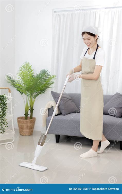 Beautiful Woman Vacuuming the Floor of Her Living Room Stock Photo ...