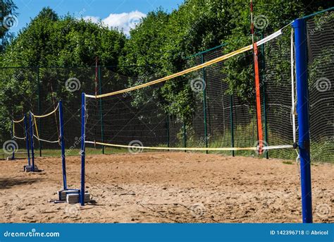 Volleyball Net on Blue Poles on Empty Sand Beach Stock Photo - Image of ...