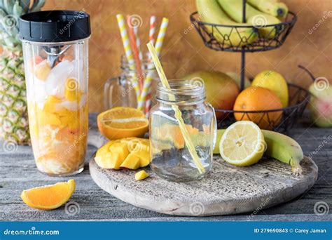 Ingredients of a Mango Citrus Smoothie in a Blender Container Ready for ...