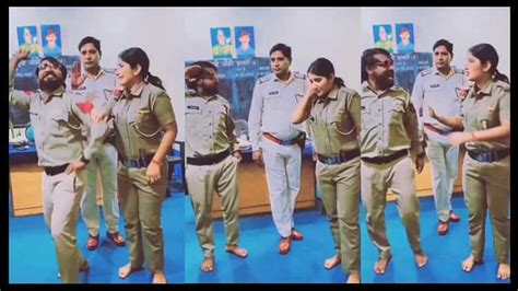 Female Police Officer Dancing With Police Officer Then Senior Officer ...