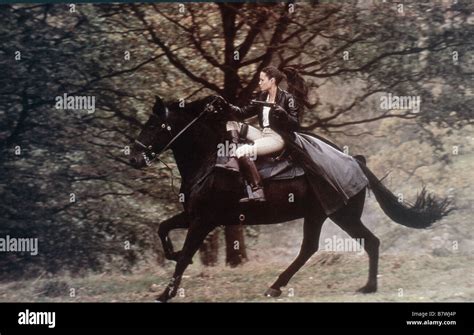 Angelina jolie tomb raider horse hi-res stock photography and images ...