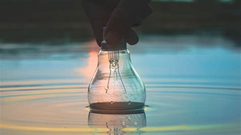 Download wallpaper 3840x2160 light bulb, hand, water, wet, waves 4k uhd ...