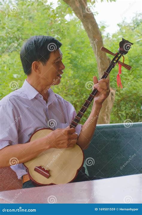 Vietnamese Man Playing a Moon Lute, a Two-string Plucked String ...