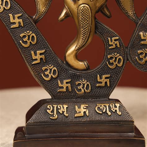 Buy Two-Toned Brass Ganesh Head With Symbolic Swastika – Ethnic India ...