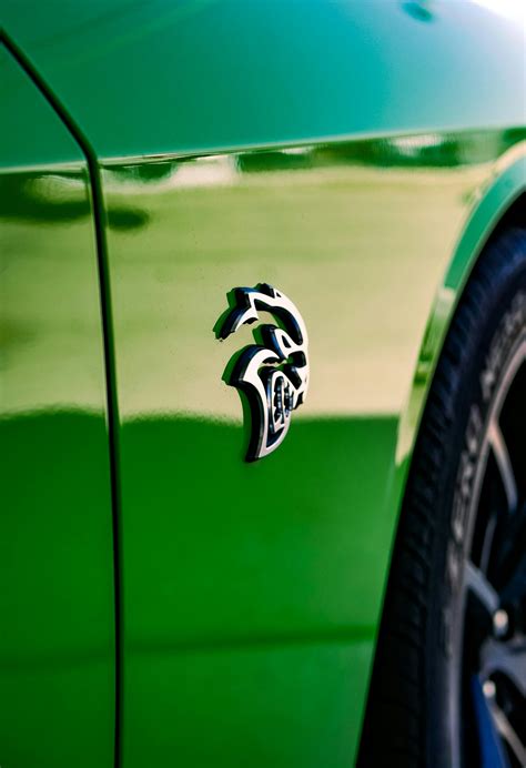 Metal Emblem on a Fender of Green Dodge Challenger SRT Hellcat · Free Stock Photo