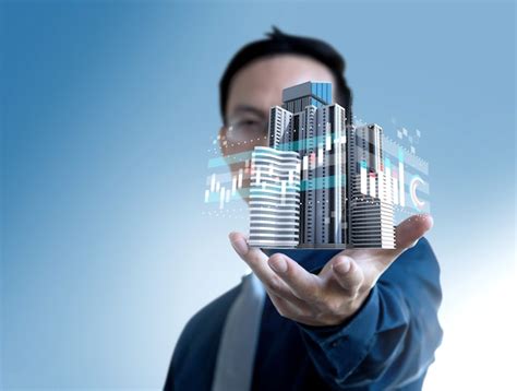 Businessman show graph value price of real estate building for ...