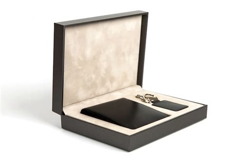 New black wallet and key case in box on white background | Free Photo