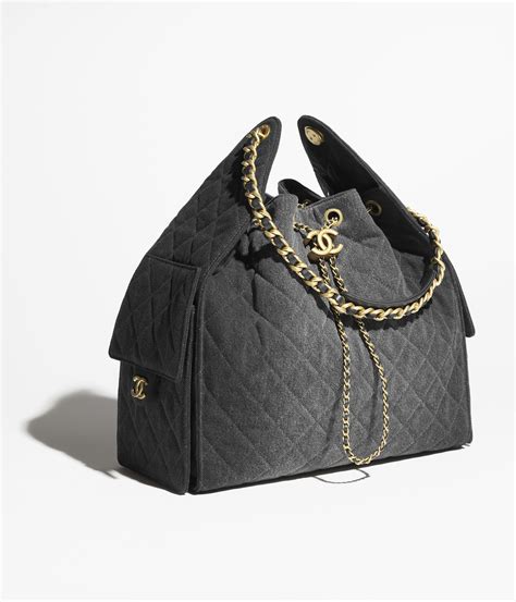 Chanel 25 medium handbag, Washed denim & gold-tone metal, black ...