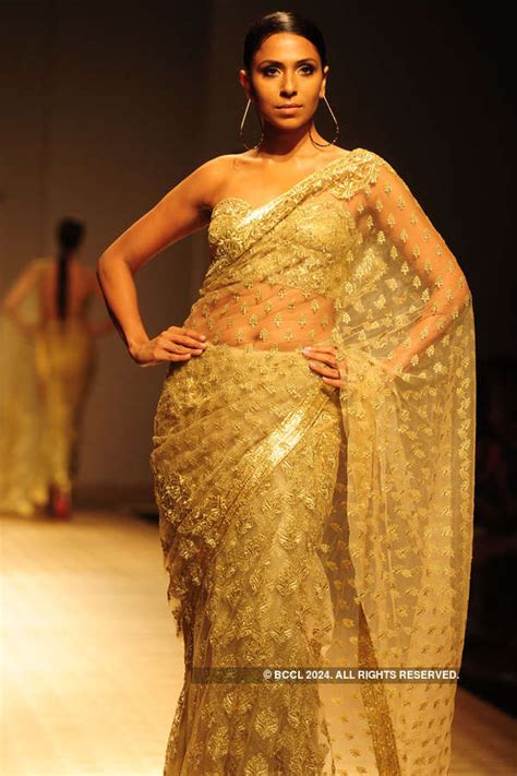 A model showcases a creation by Rabani and Rakha on Day 4 of Wills ...