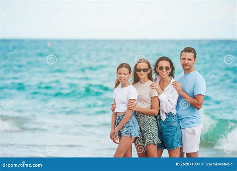 Happy Family Posing on the Beach during Summer Vacation Stock Image ...