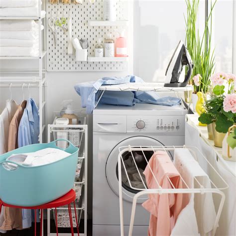 Affordable laundry room with JONAXEL shelving unit - IKEA