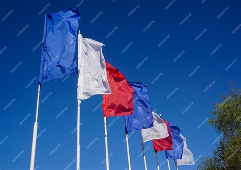Premium Photo | Blue-white-red flags on a blue sky background