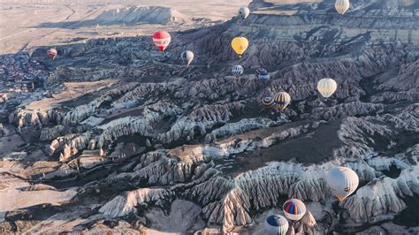 Download wallpaper 2560x1440 air balloons, rocks, flight, view from ...
