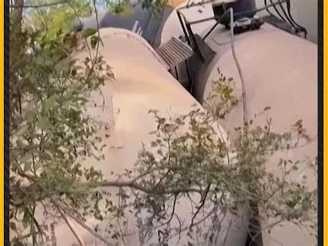 Tank cars and containers are piled up after a union pacific railroad ...