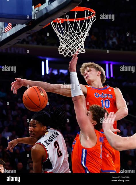 Florida forward Thomas Haugh (10) defends against UConn guard Silas ...