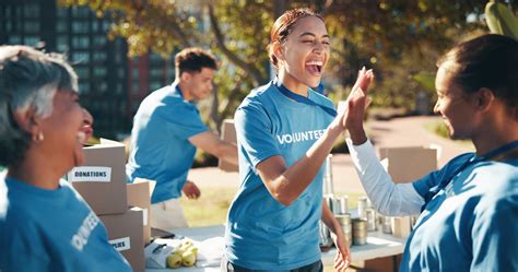 High five, volunteer and charity in teamwork for community service, project or nonprofit ...