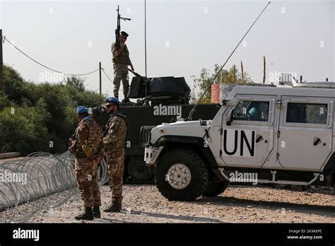 FILE PHOTO: United Nations peacekeepers (UNIFIL) and Lebanese army soldiers stand guard at a checkpoint in Naqoura, near the Lebanese-Israeli border, southern Lebanon, October 27, 2022. REUTERS/Aziz Taher/File Photo