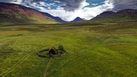 Wallpaper hut, building, field, grass, rocks hd, picture, image