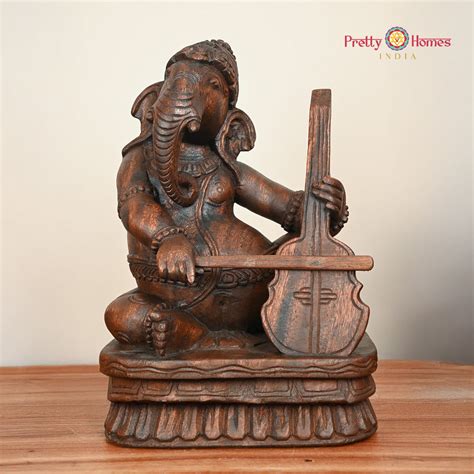 Ganesha Playing Musical Instrument Statue | Pretty Homes India