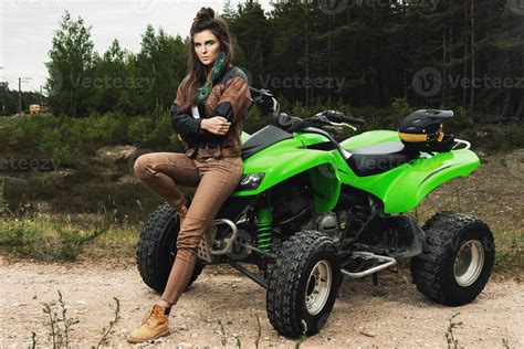 Stylish and beautiful woman and the ATV 16233806 Stock Photo at Vecteezy