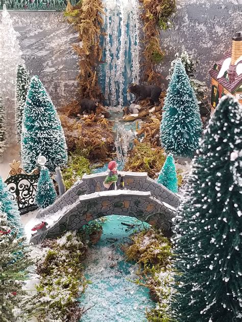 Christmas Village Display with Miniature Waterfall and Bridge