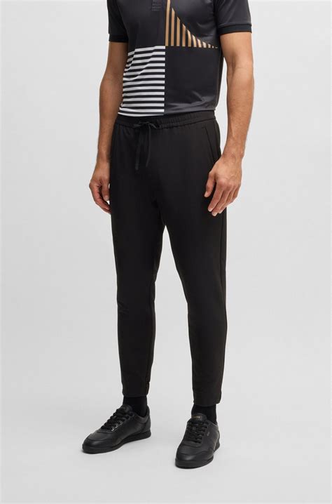 BOSS - Tapered-fit trousers in water-repellent stretch fabric - Black