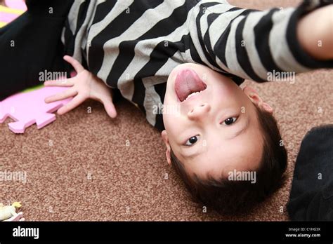 Young boy being naughty Stock Photo - Alamy