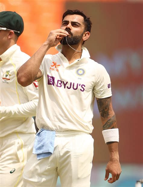 Virat Kohli says a quiet prayer after scoring his first Test century ...