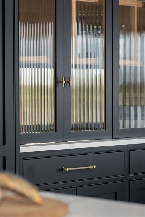 Reeded glass fronted cabinets | Handmade kitchens | Holland Kitchens ...