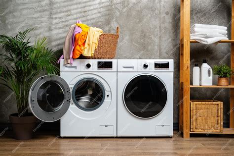 Premium Photo | Modern white washing machines in laundry room with open ...