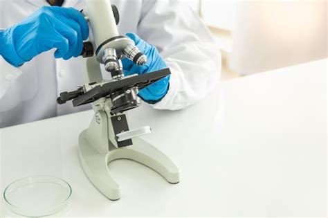 Image result for A Person Inspecting Using Microscope