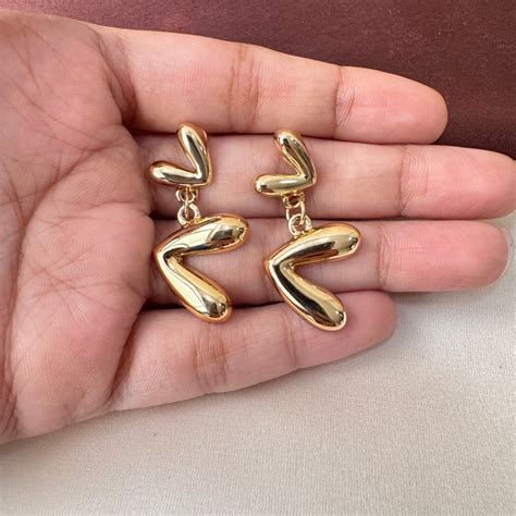 TFC Dual Hanging Heart Gold Plated Dangler Earrings