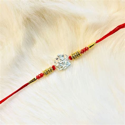 Vighnaharta Ganesh Rakhi – Au Revoir - Your Charm Is Waiting