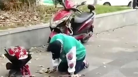 China: Man spends 21 hours on knees in rain outside ex-girlfriend ...