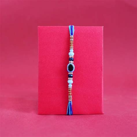 Send Evil Eye Rakhi with Chocolates N Lucky Bamboo Plant Online