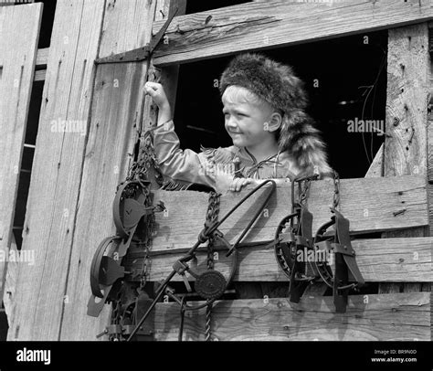 1950s BOY DRESSED IN COONSKIN HAT & FRINGED VEST LIKE DAVY CROCKETT ...