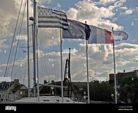 Flags blowing in wind hi-res stock photography and images - Alamy
