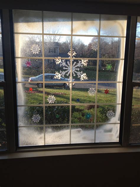 Christmas window art. Spray snow and cling ons | Christmas window ...