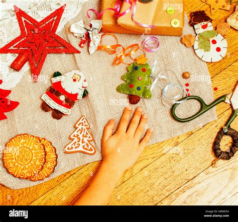 handmade christmas gifts in mess with toys, candles, fir, ribbon Stock ...