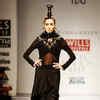 A model showcases a creation by designer Anamika Khanna on Day 4 of the ...