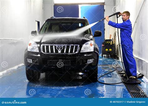 Young Man Washing His Car With Compression Water Editorial Photography - Image: 48702317