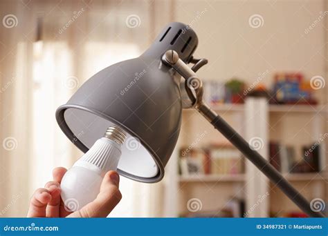 Hand Changing a Regular Light Bulb for LED Stock Image - Image of lamp ...