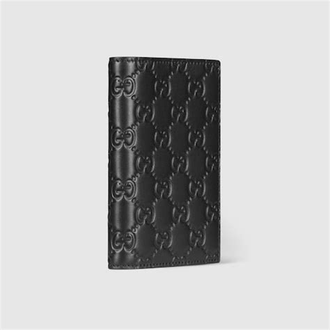 GG Emblem系列护照夹 in 黑色GG皮革 | GUCCI® UK