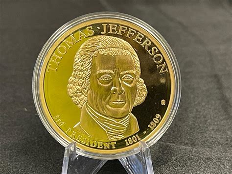 Lot - AMERICAN MINT 50MM PRESIDENTIAL DOLLAR TRIALS THOMAS JEFFERSON COIN