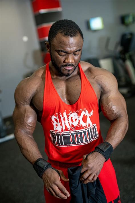 Strong muscular man in gym training athlete powerful young bodybuilder ...