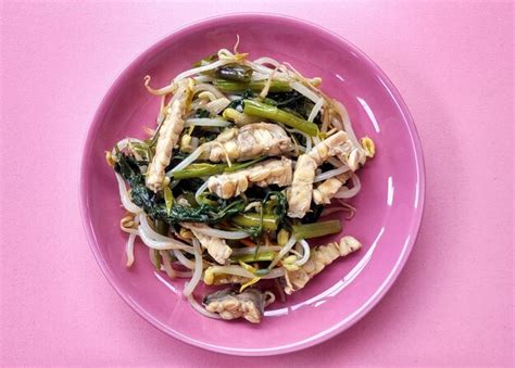 Healthy food from a mixture of kale, bean sprouts and tempeh. cooked ...