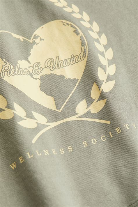 Cropped printed top - Light khaki green/Feeling Good - Ladies | H&M IN